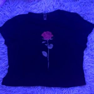 black short sleeve tee with red rose in middle.